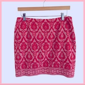 SILKLAND mini skirt elegantly embroidered in pearls and red crystals.